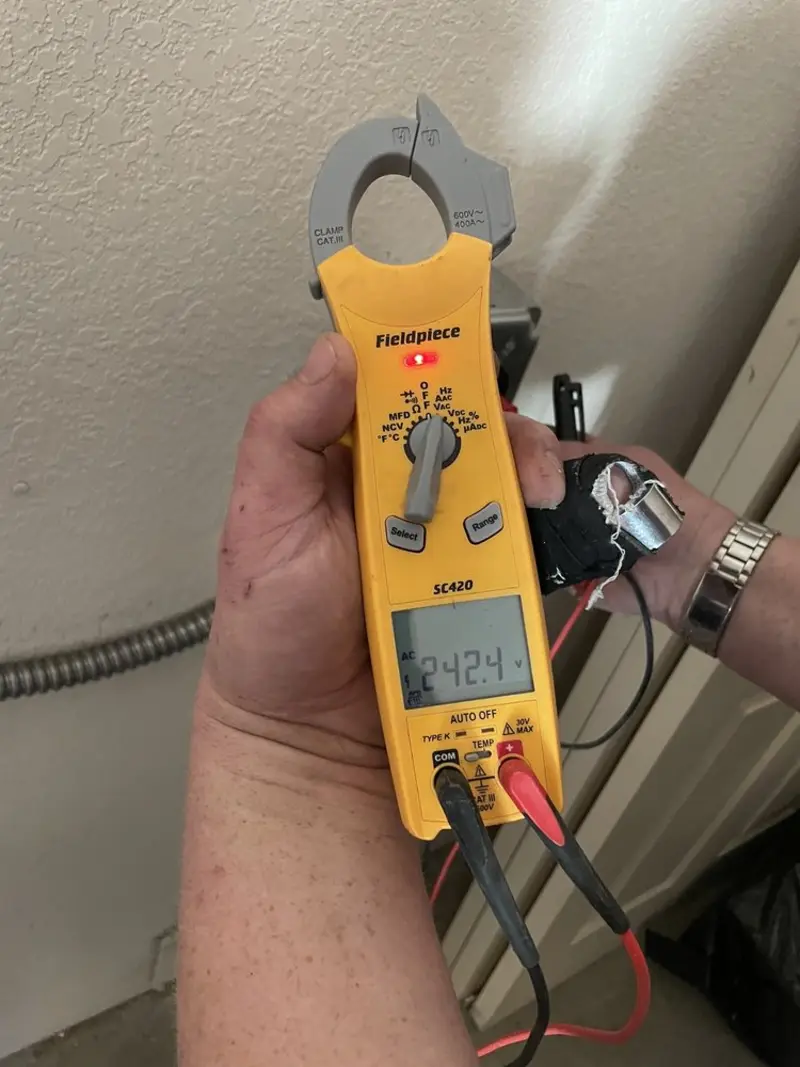 Voltage testing with clamp meter during Generator Installation in Rotonda